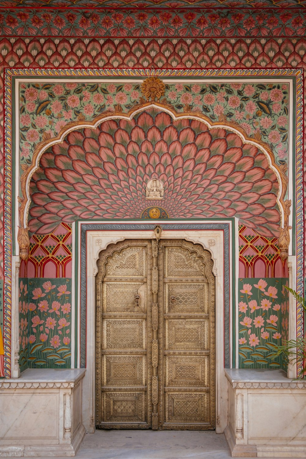a large wooden door in a colorful building