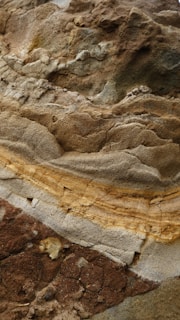 a close up of a rock with a yellow line on it