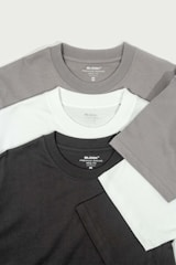 a group of three different colored t - shirts