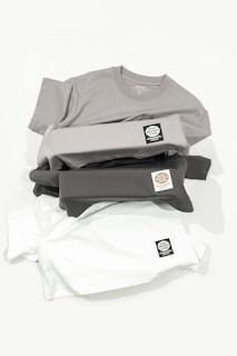 a pile of shirts sitting on top of each other