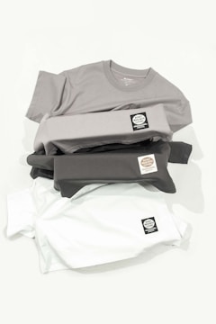 a pile of shirts sitting on top of each other