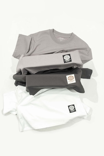 a pile of shirts sitting on top of each other