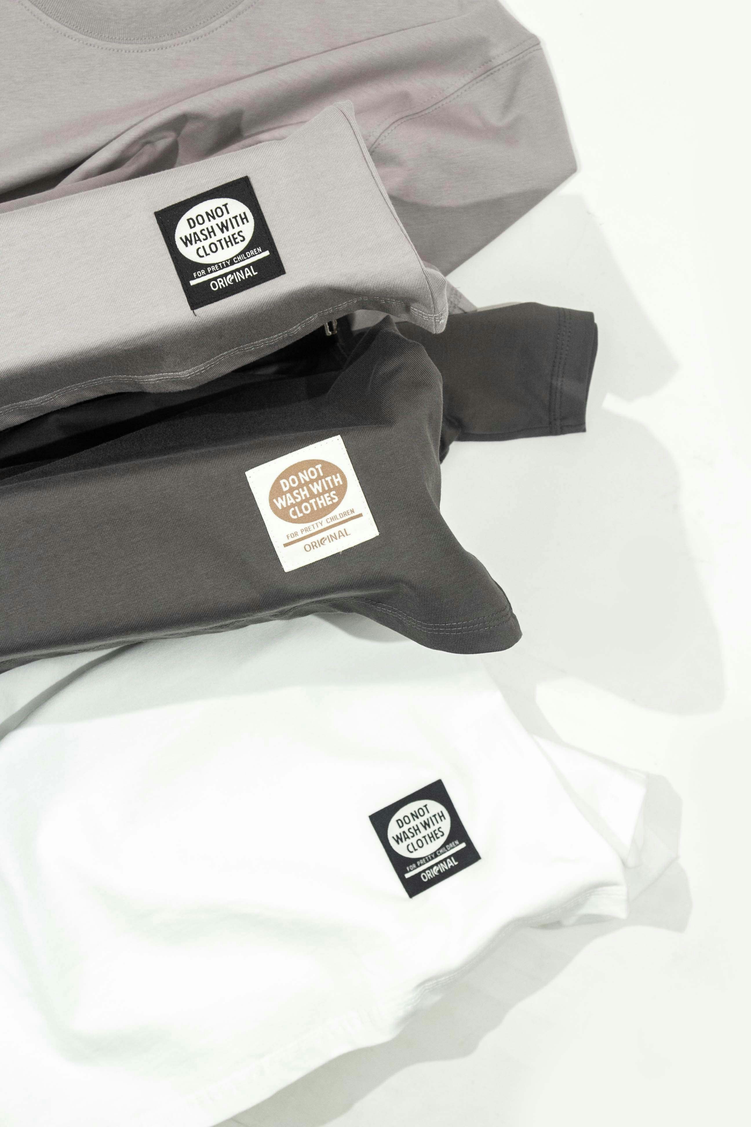 a pile of shirts sitting on top of each other