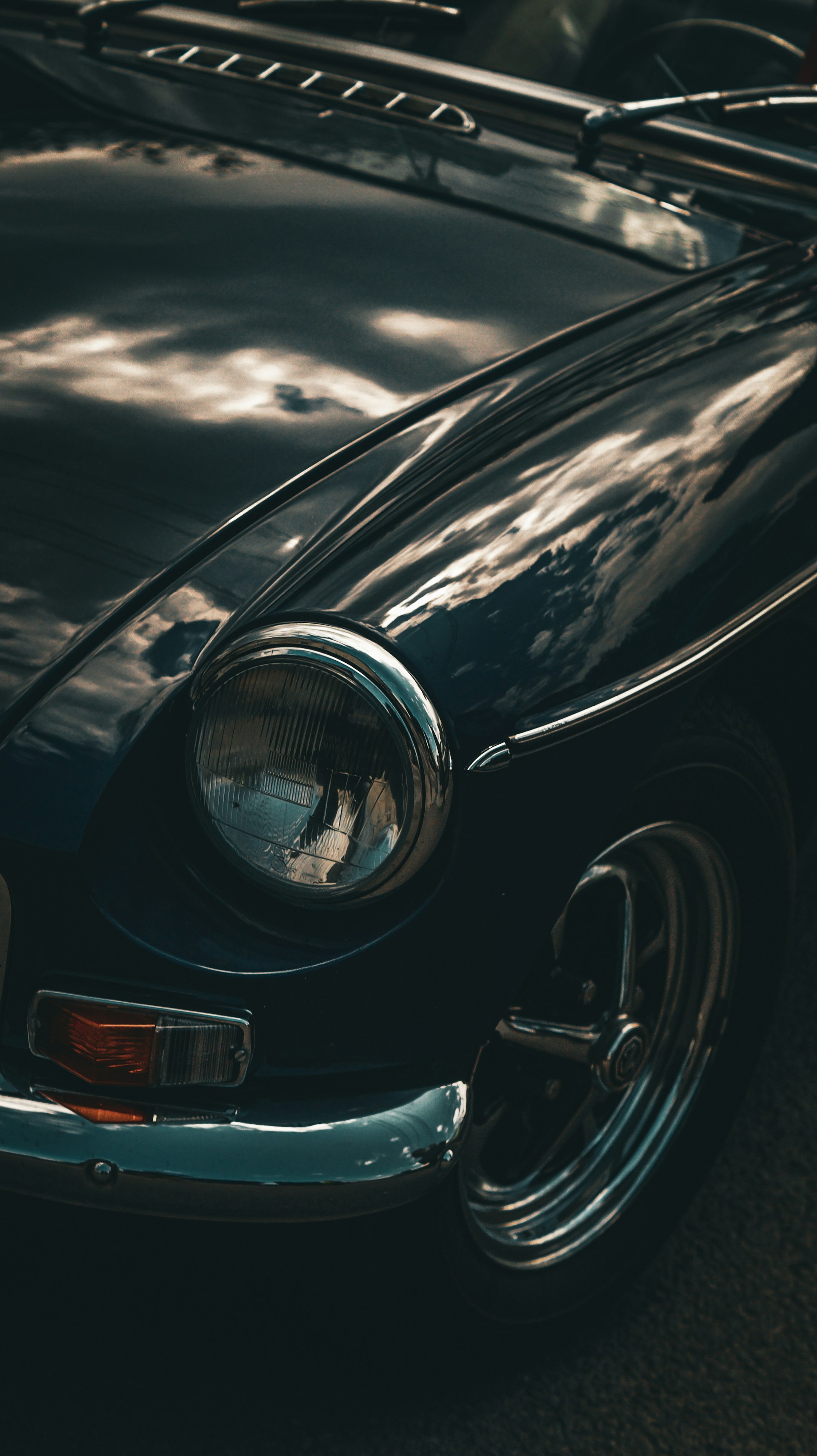 a close up of the front end of a black car