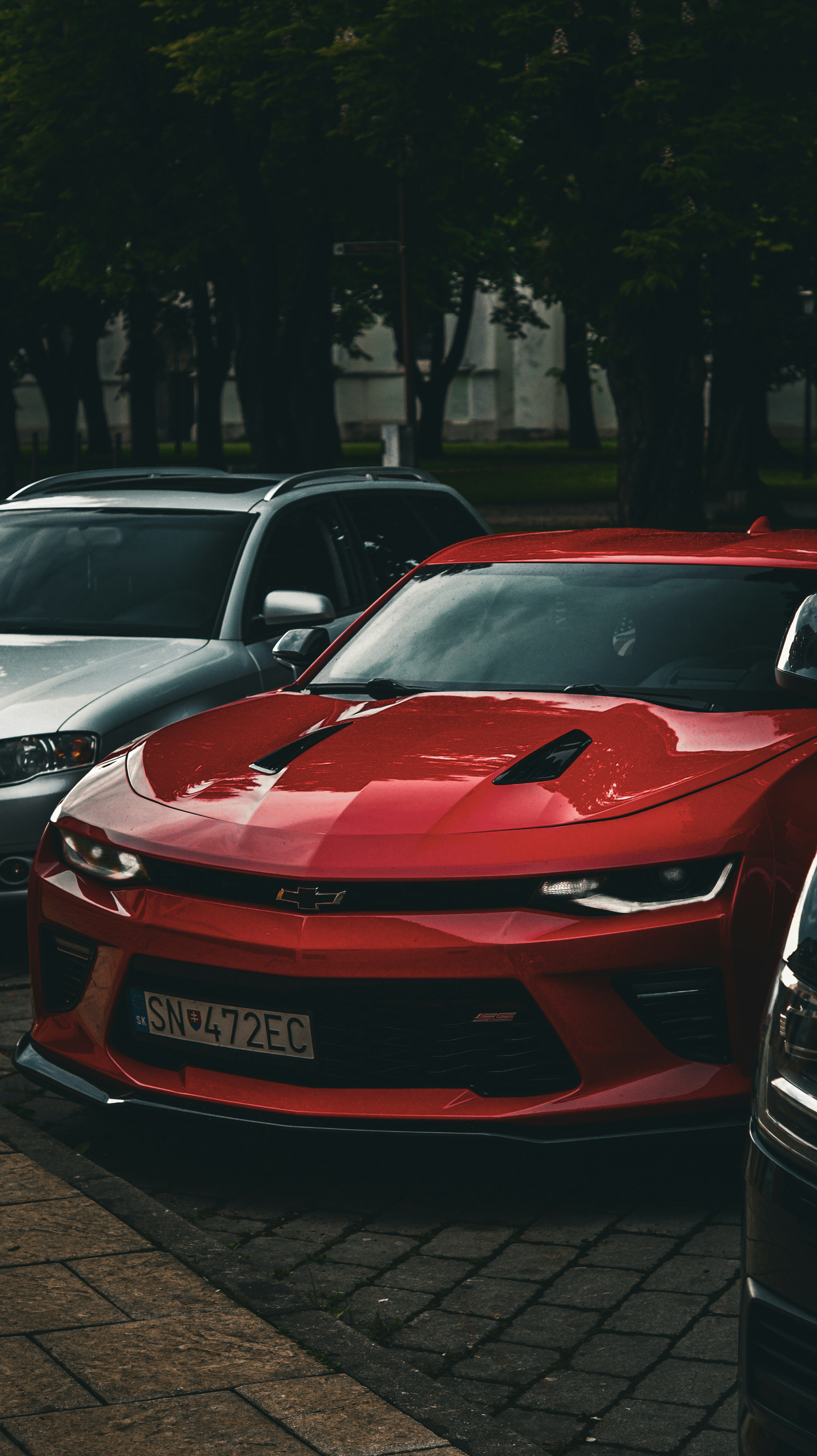 a red sports car parked in a parking lot