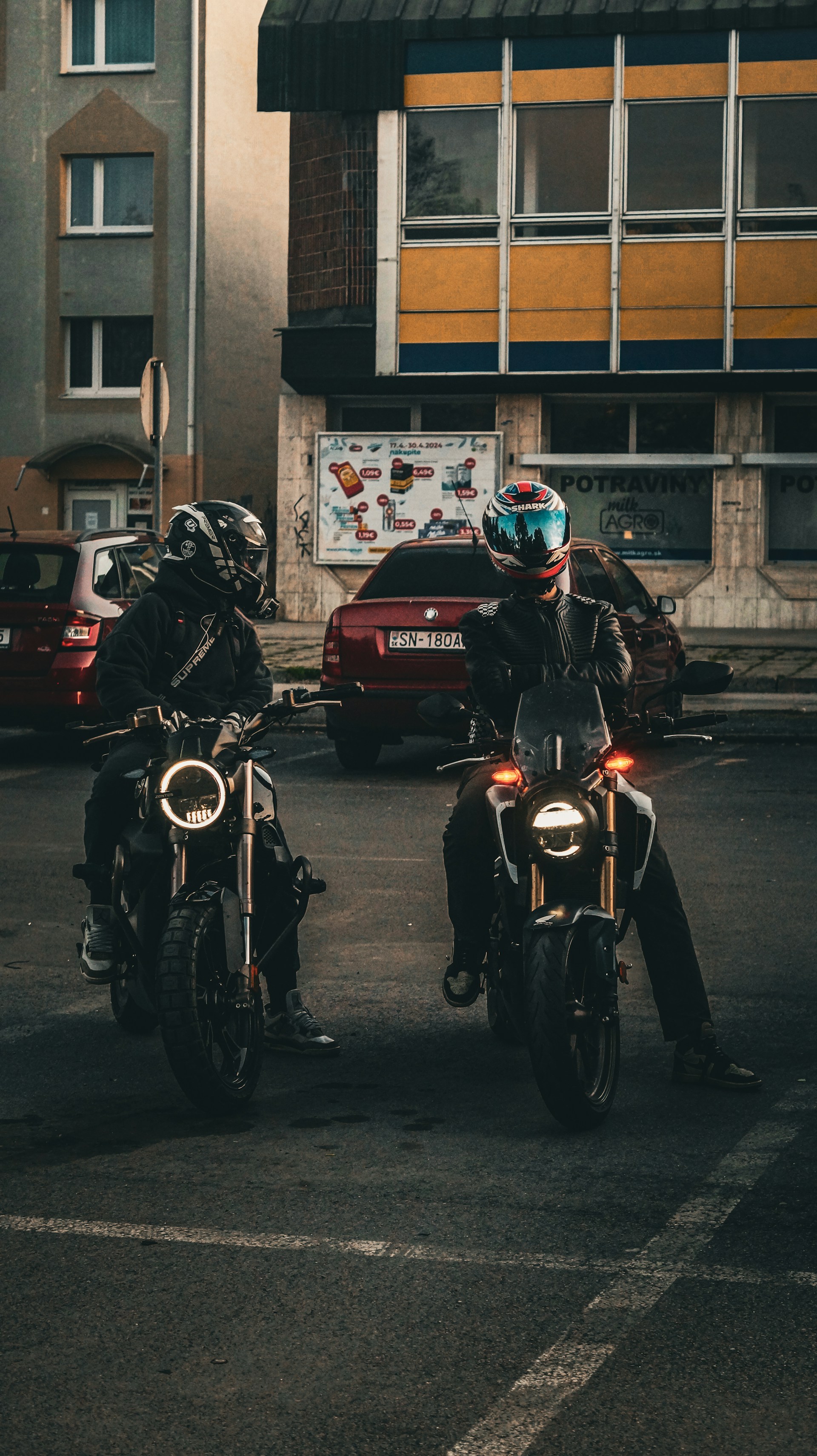 a couple of people that are sitting on motorcycles