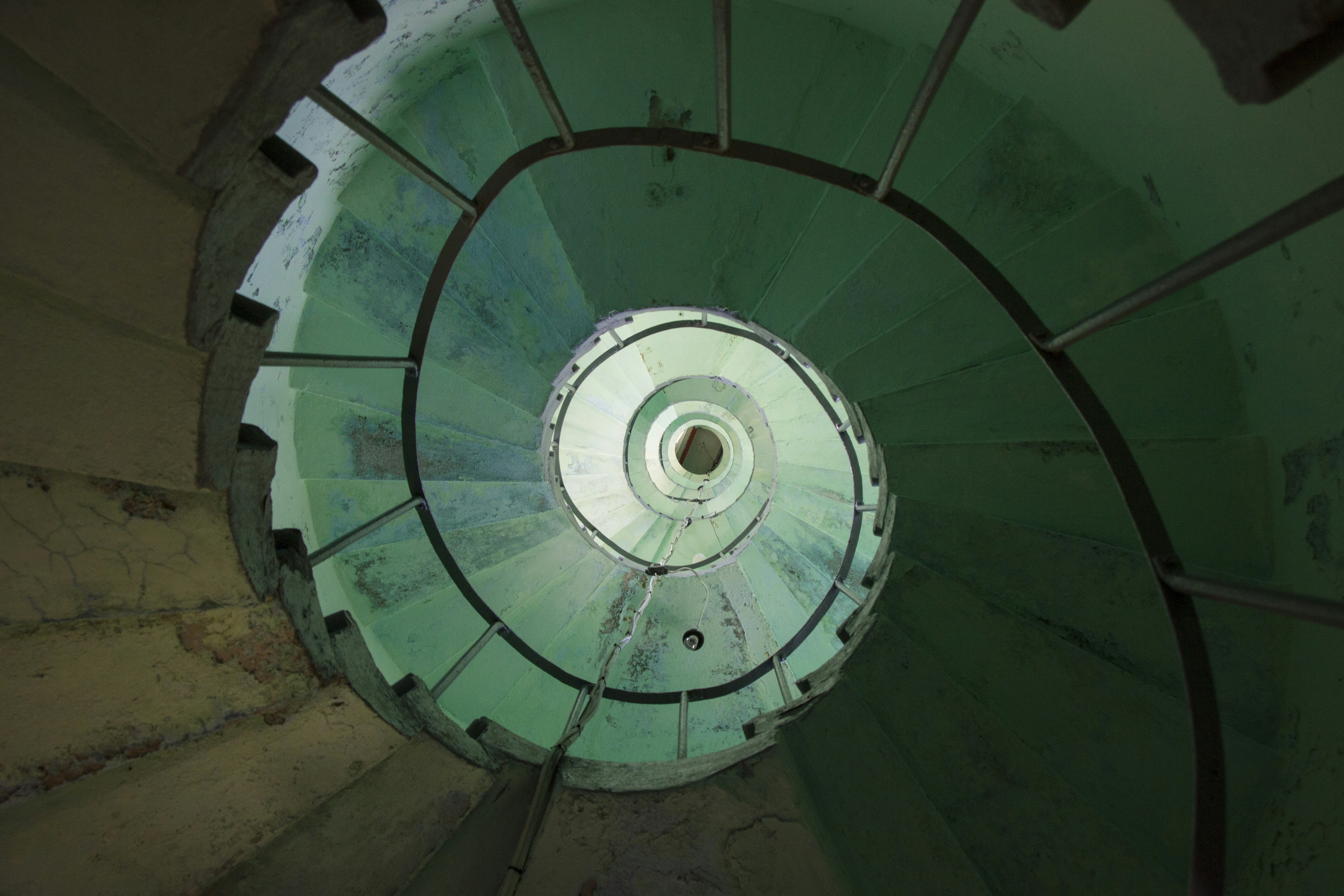 a view down the side of a spiral staircase