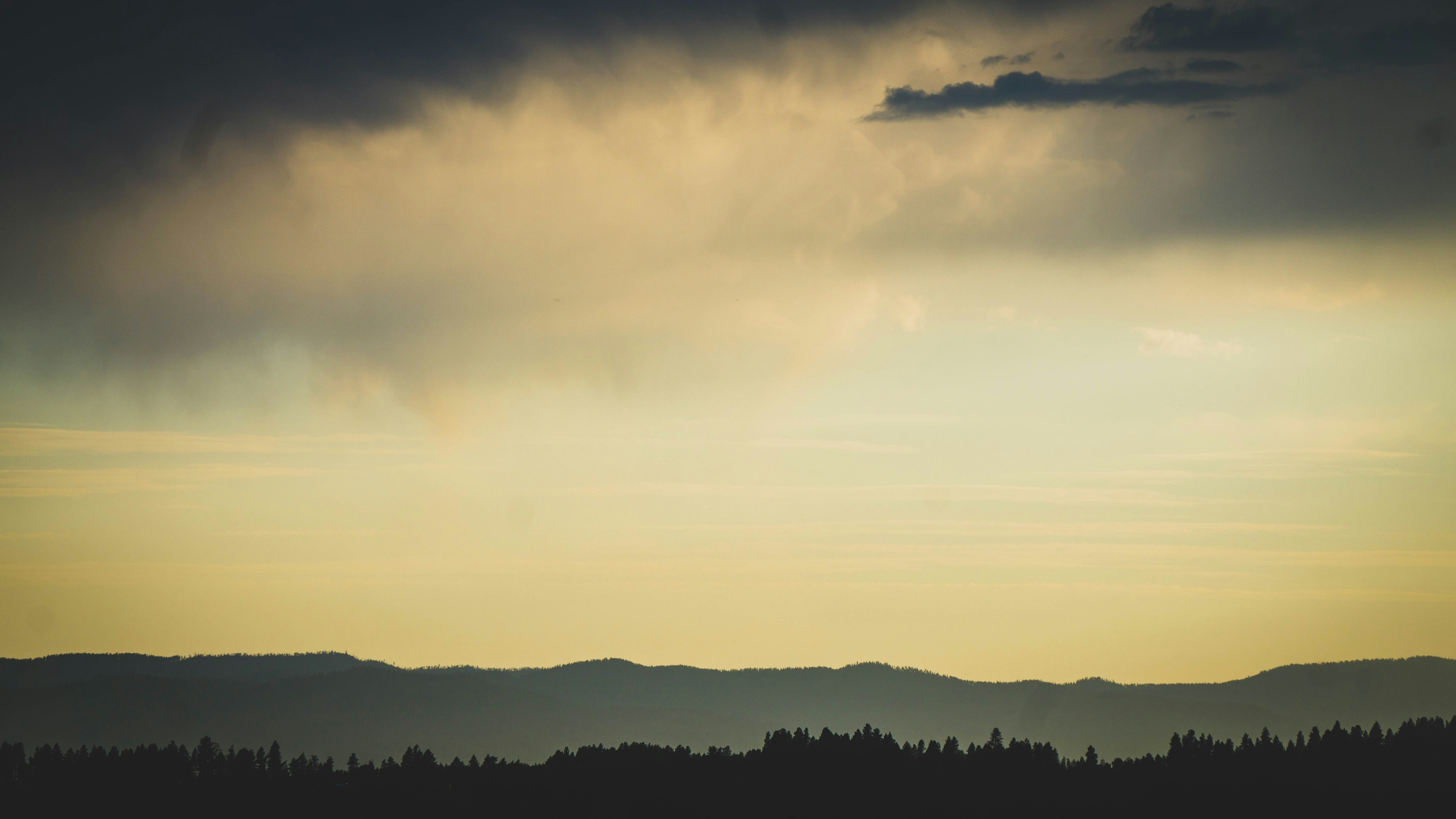a view of a mountain range at sunset