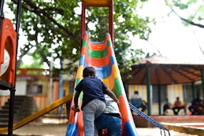 A couple of people that are on a slide