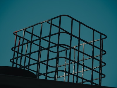 a metal basket sitting on top of a roof