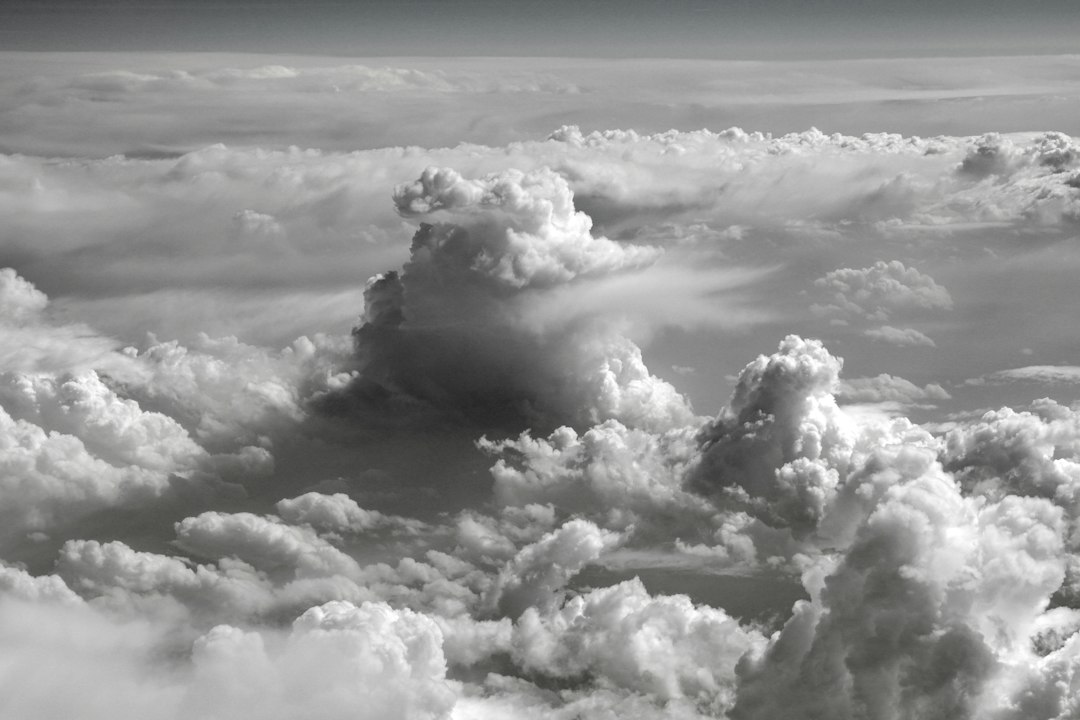 a black and white photo of clouds in the sky
