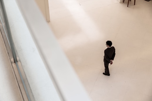 a man in a suit standing in a room