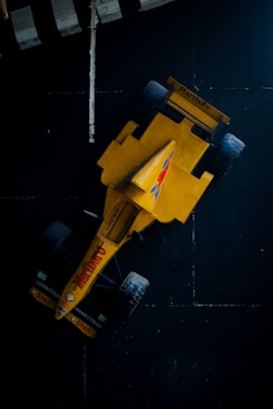 an overhead view of a yellow race car