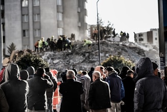 a group of people standing in front of a building