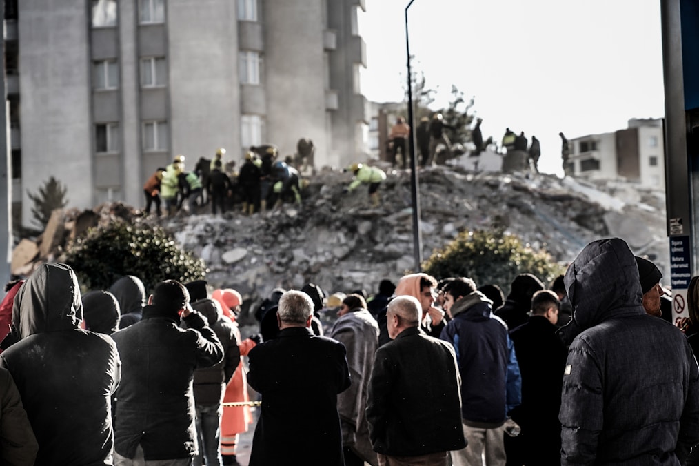 a group of people standing in front of a building