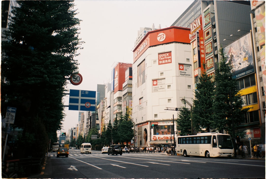 a city street filled with traffic and tall buildings,