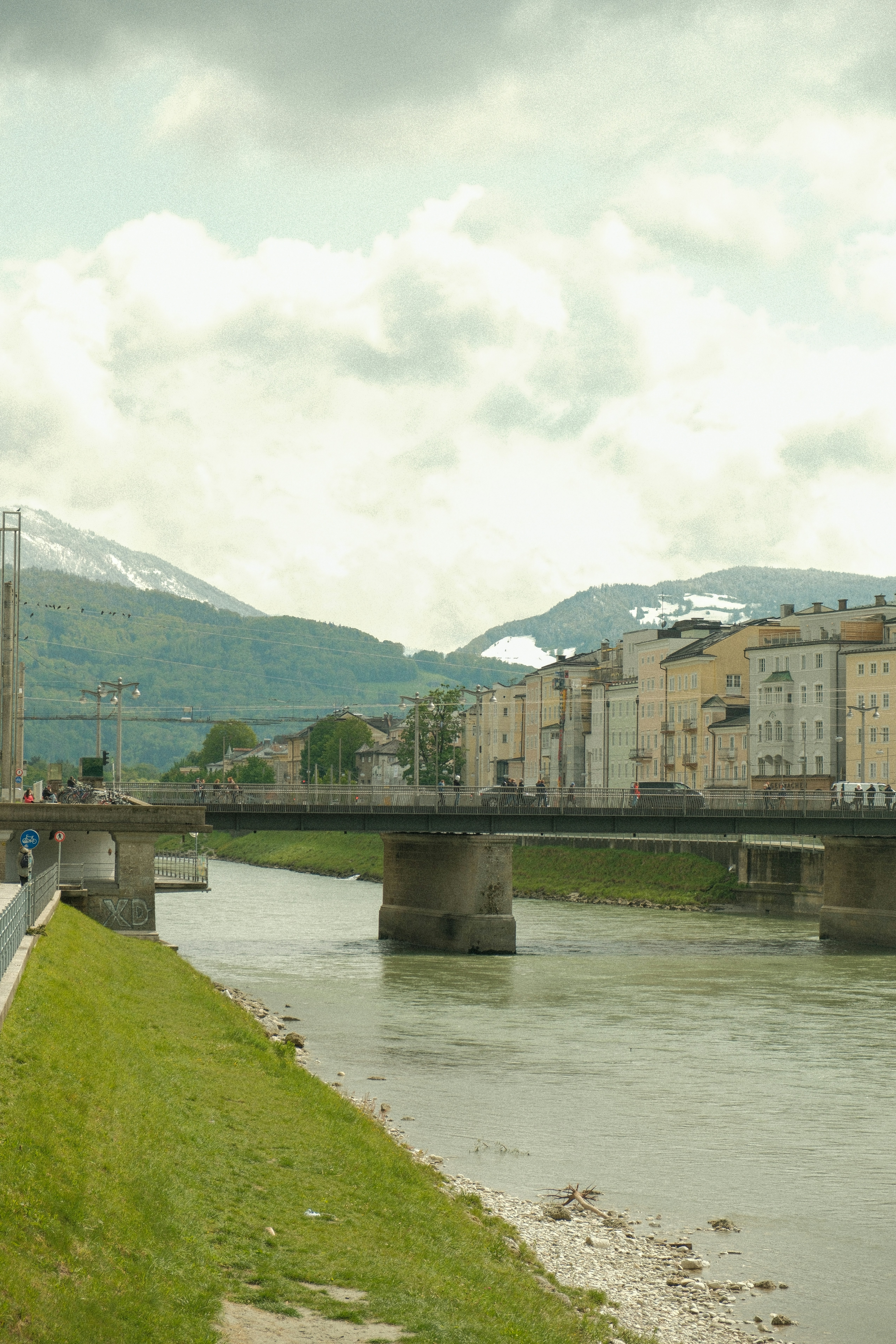 a train traveling over a bridge over a river