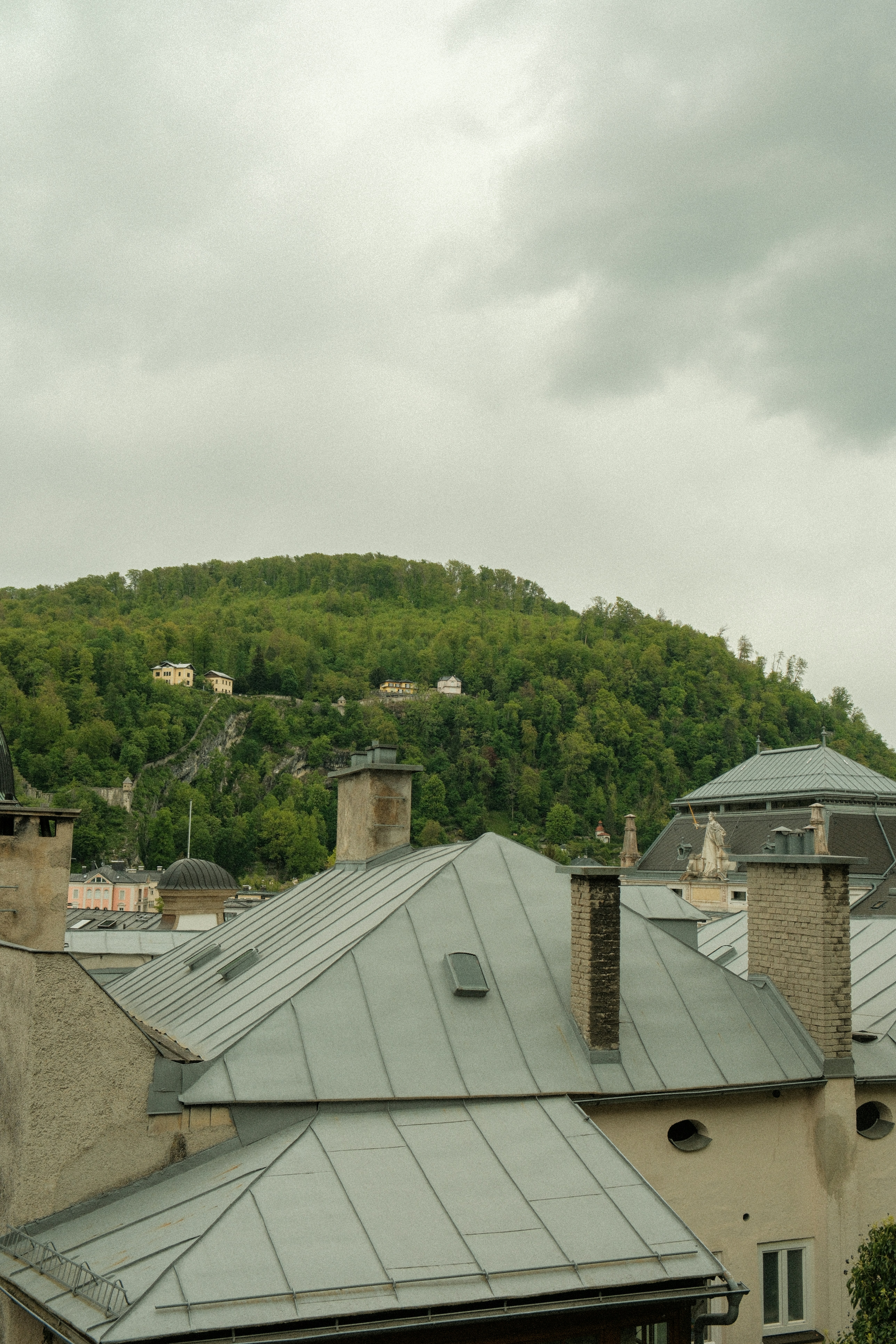 a view of a building with a mountain in the background