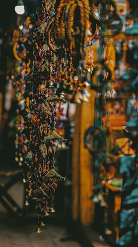 a bunch of beads hanging from a ceiling