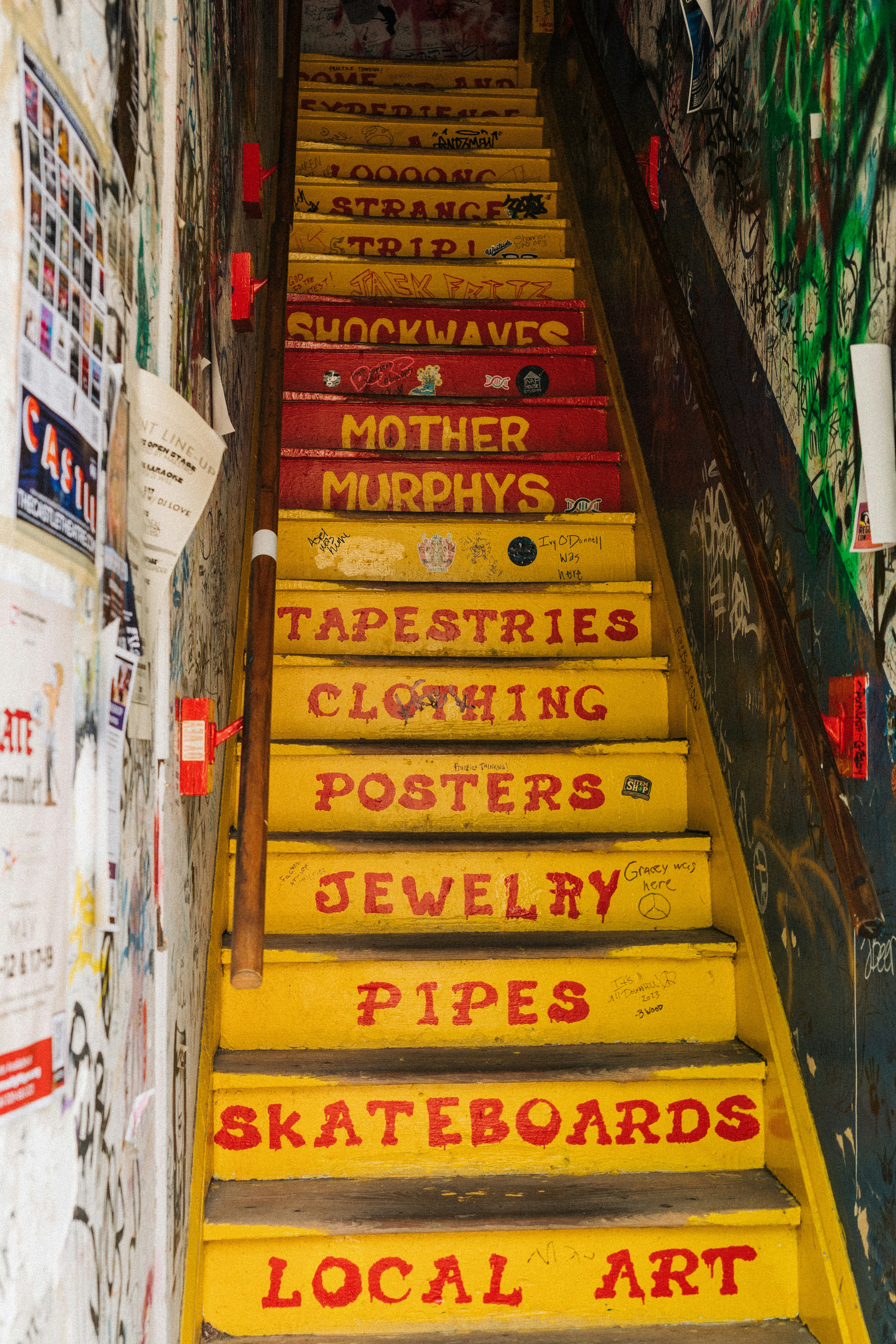 A set of yellow steps with red writing on them