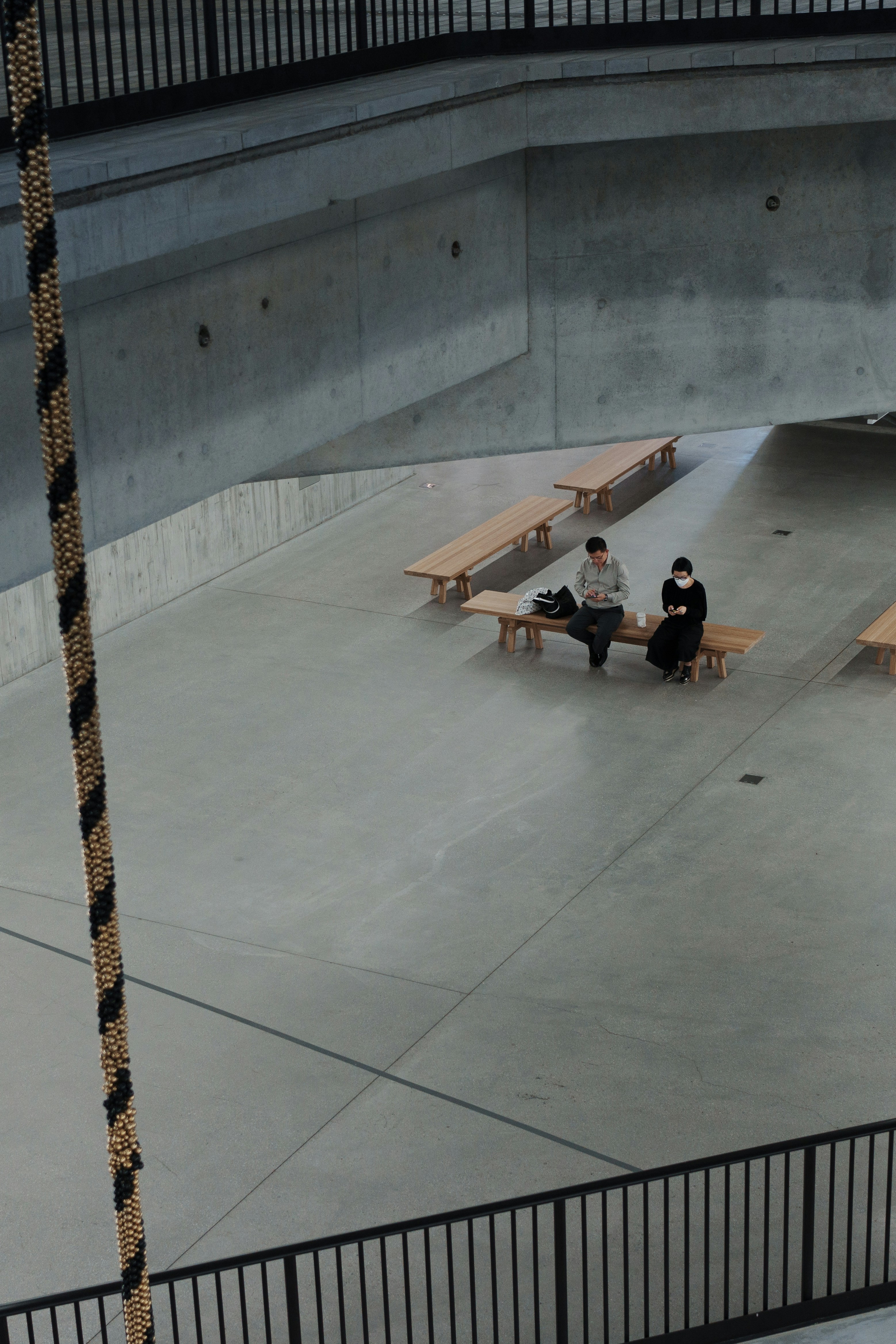a group of people sitting on top of benches