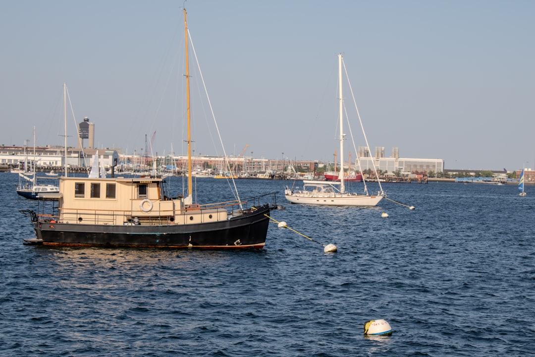 a couple of boats floating on top of a body of water, Boats in Boston