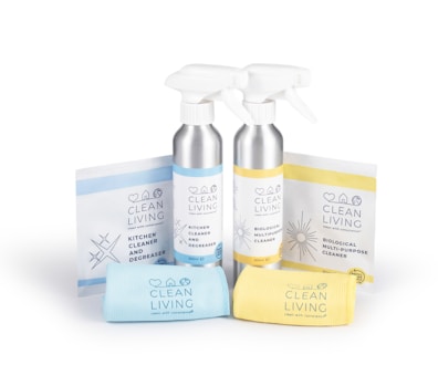 a couple of bottles of cleaning products next to a towel