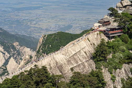 a group of people standing on top of a mountain