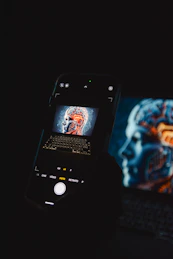 phone photographing screen with ai face