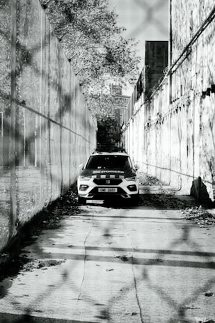 a black and white photo of a police car