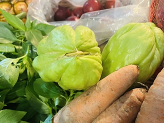 a pile of vegetables sitting on top of a table