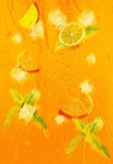 a picture of some oranges and limes on a table