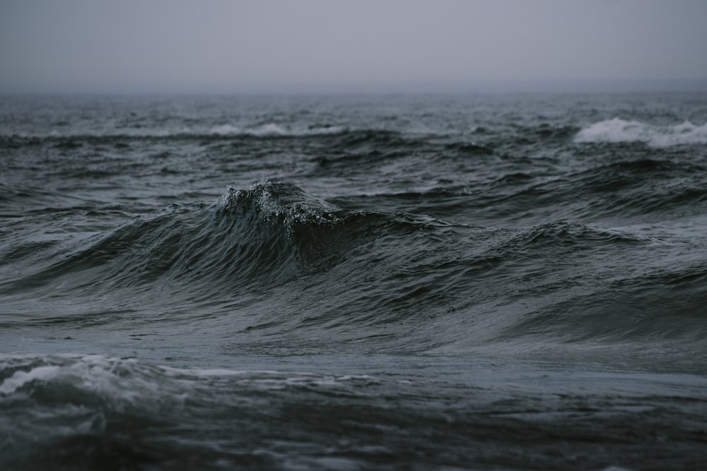 a large body of water with waves coming in