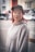 a woman with red hair wearing a hat
