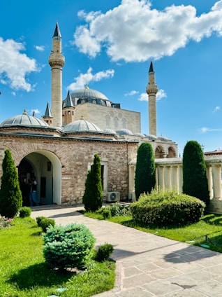 a large building with two towers and a walkway
