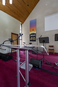 a room with a metal table and musical equipment