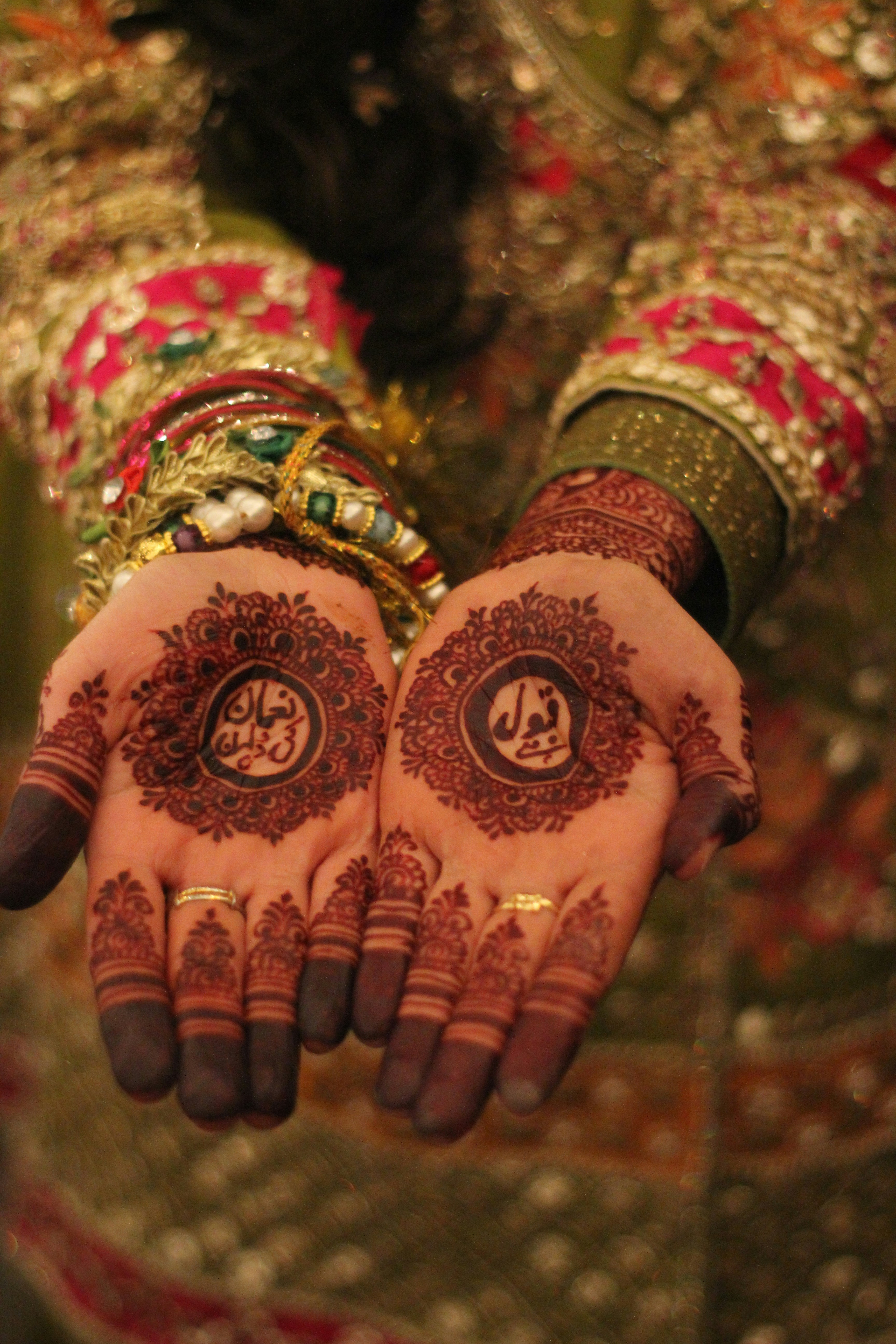 a close up of a person's hands with henna
