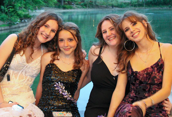 a group of young women standing next to each other