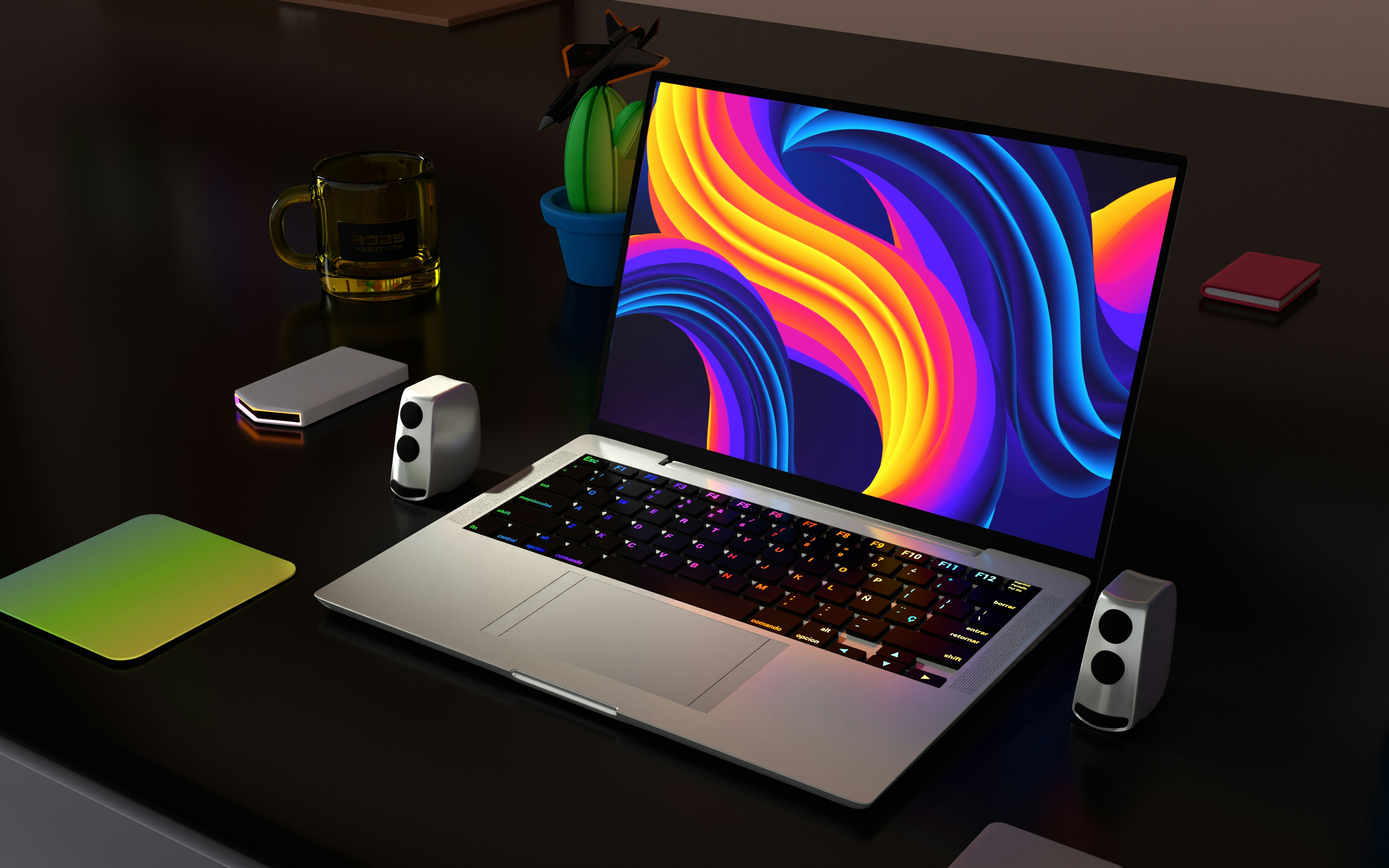 Technical specs of Windows on Mac for business students - a dark room with a gamer-like setup featuring a Mac laptop running Windows with a colorful RGB keyboard