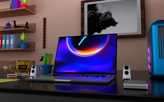 a laptop computer sitting on top of a desk
