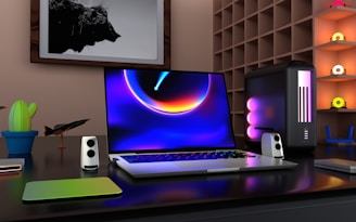 a laptop computer sitting on top of a desk