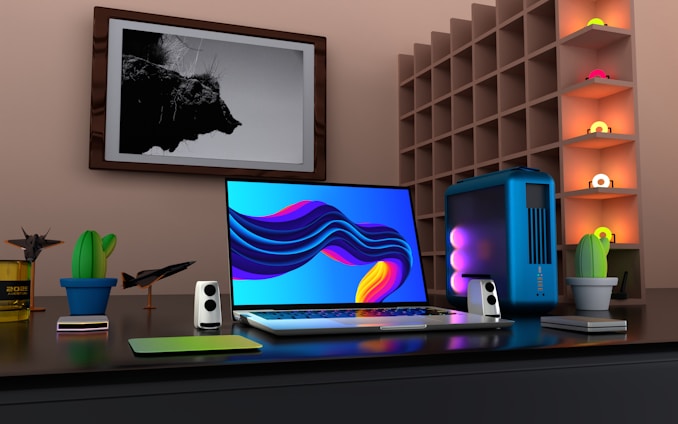 a laptop computer sitting on top of a desk