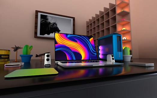 a laptop computer sitting on top of a desk