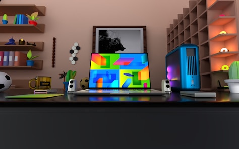 a laptop computer sitting on top of a desk