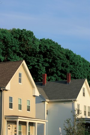 A street lined with homes and trees, showing the kind of starter neighborhood attainable housing aims to create