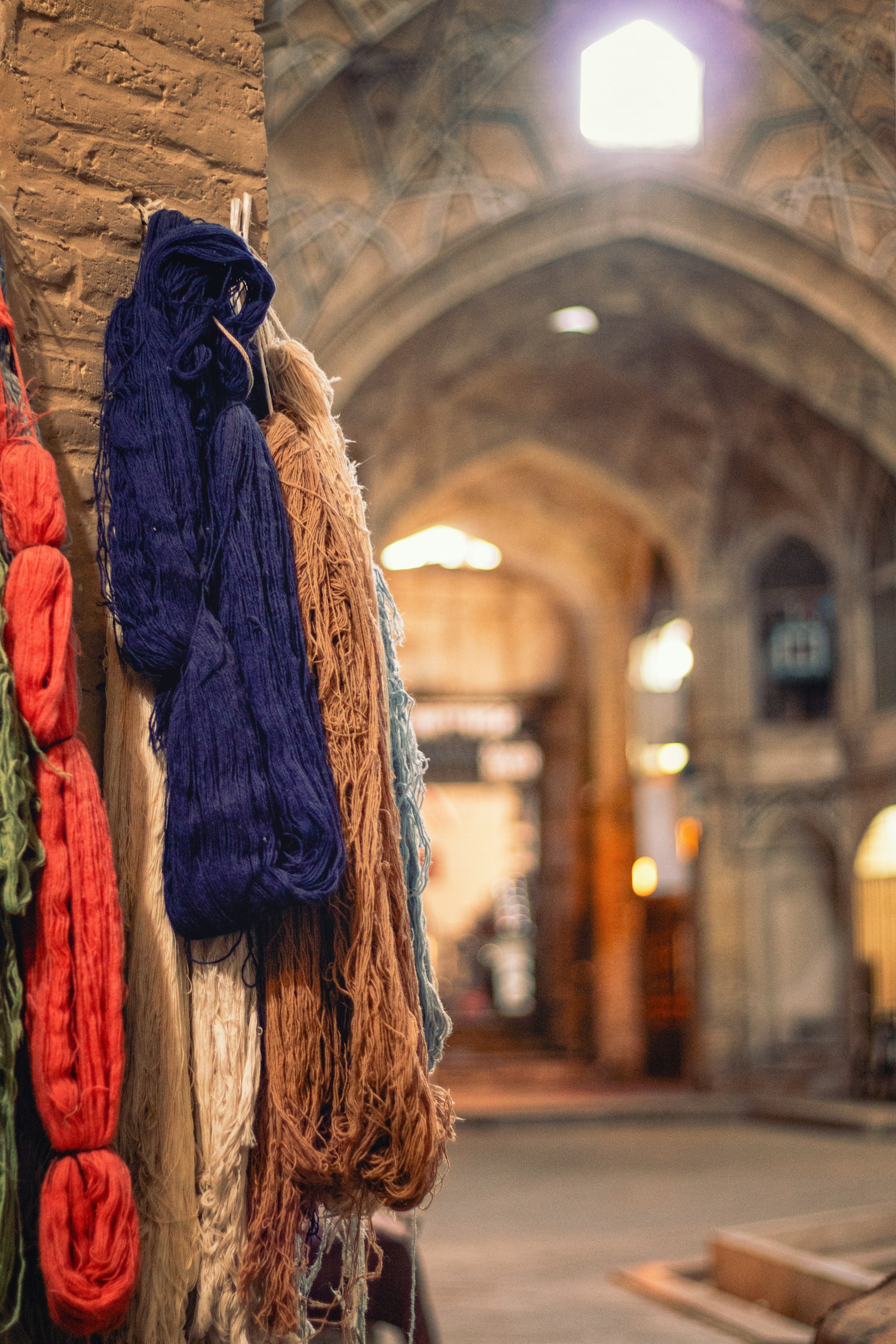 a bunch of sweaters hanging on a wall