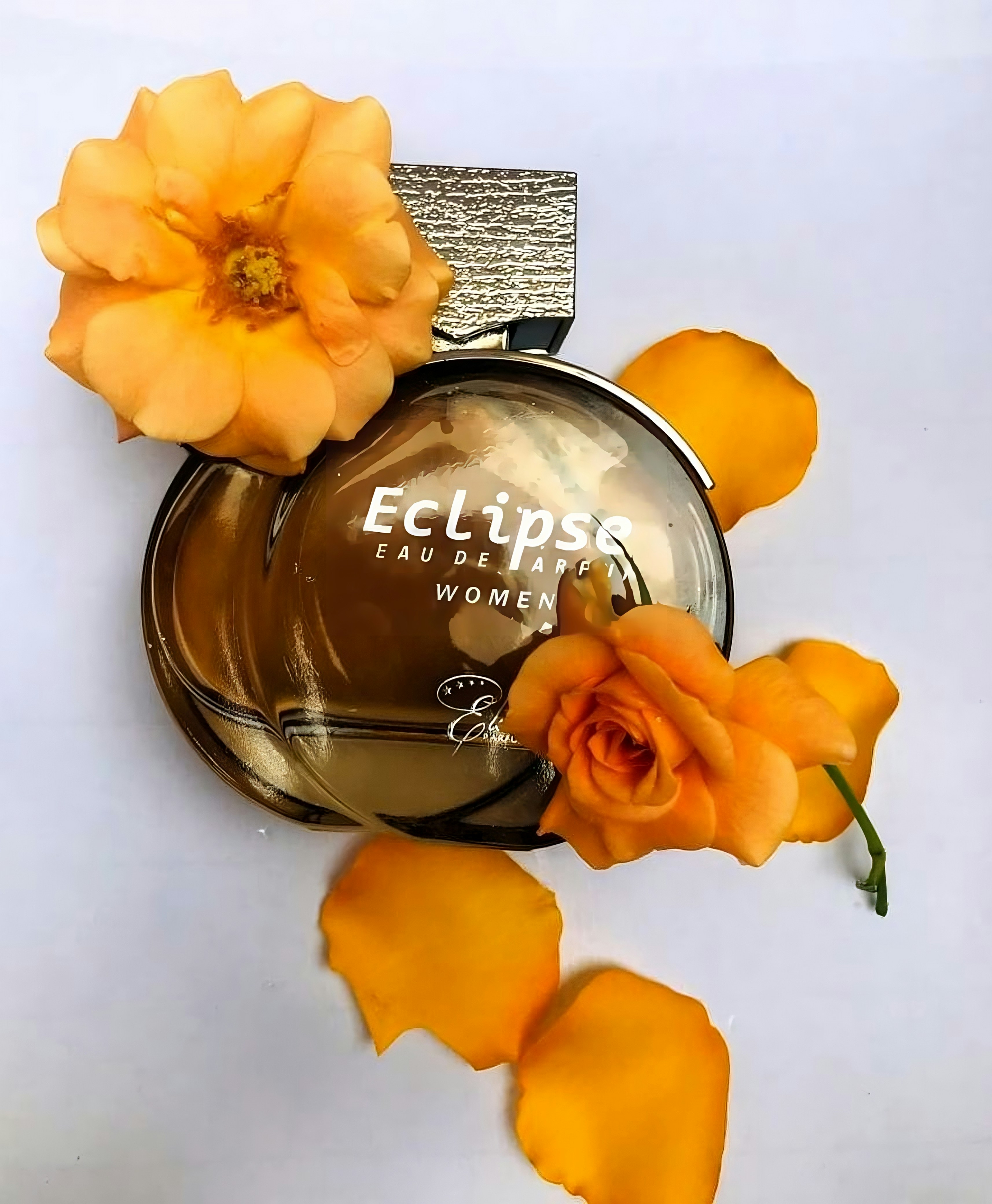 Luxury perfume bottle surrounded by fresh jasmine flowers and rose petals on dark velvet, soft golden light