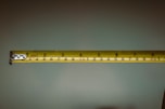 a person holding a tape measure in their hand