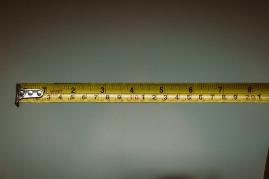 a person holding a tape measure in their hand