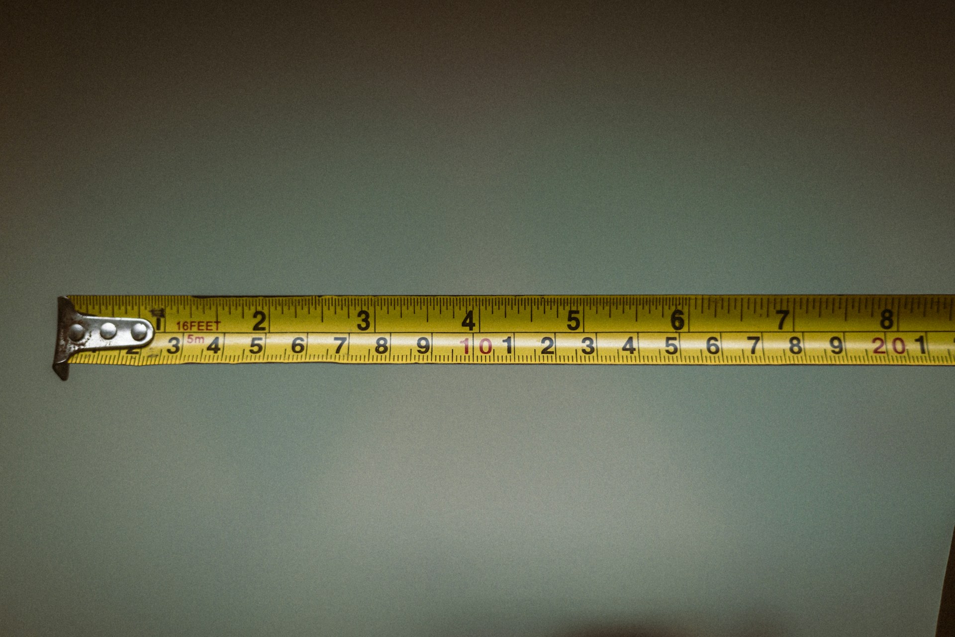 a person holding a tape measure in their hand